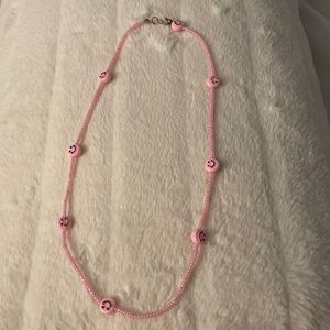 Handmade pink tiny seed beads with pink smiley faces